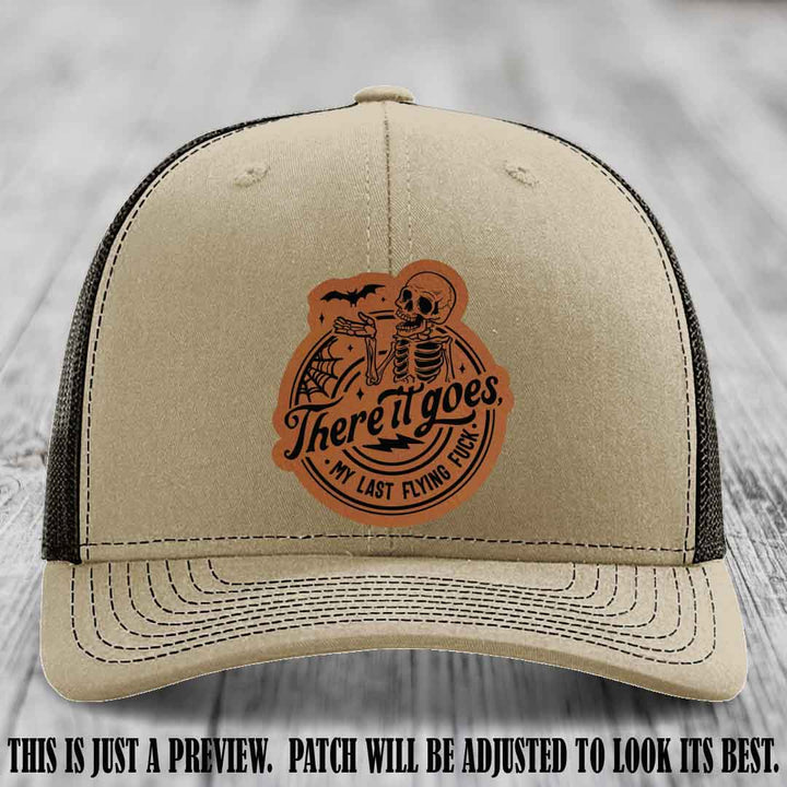 There It Goes design on Rawhide to Black Patch, displayed on a Khaki to Coffee Hat, funny Richardson 112 leather patch hat