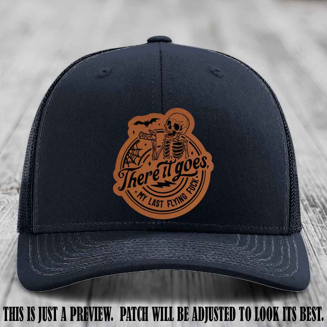 There It Goes design on Rawhide to Black Patch, displayed on a Navy Hat, funny Richardson 112 leather patch hat