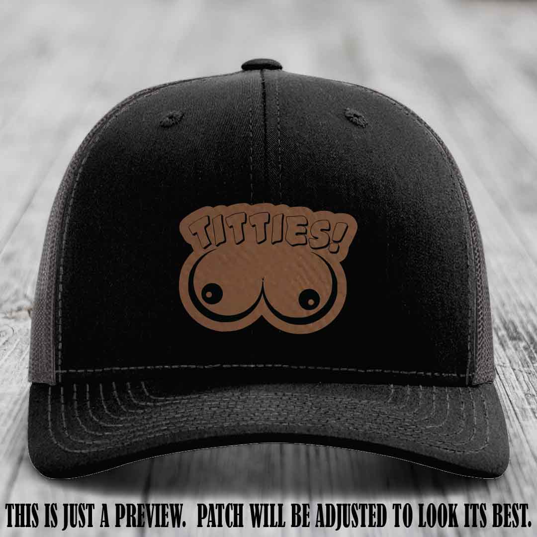 TITTIES! leather patch on Dark Brown to Black Patch mounted on a Black to Charcoal Hat – Richardson 112 funny trucker hat