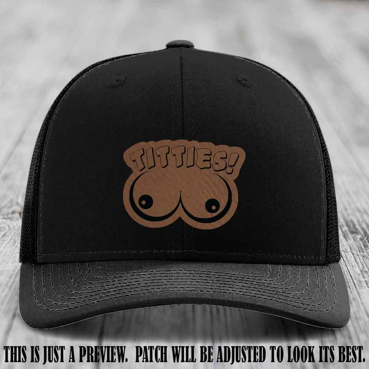 TITTIES! leather patch on Dark Brown to Black Patch mounted on a Black Hat – Richardson 112 funny trucker hat