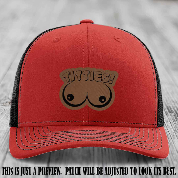 TITTIES! leather patch on Dark Brown to Black Patch mounted on a Red to Black Hat – Richardson 112 funny trucker hat