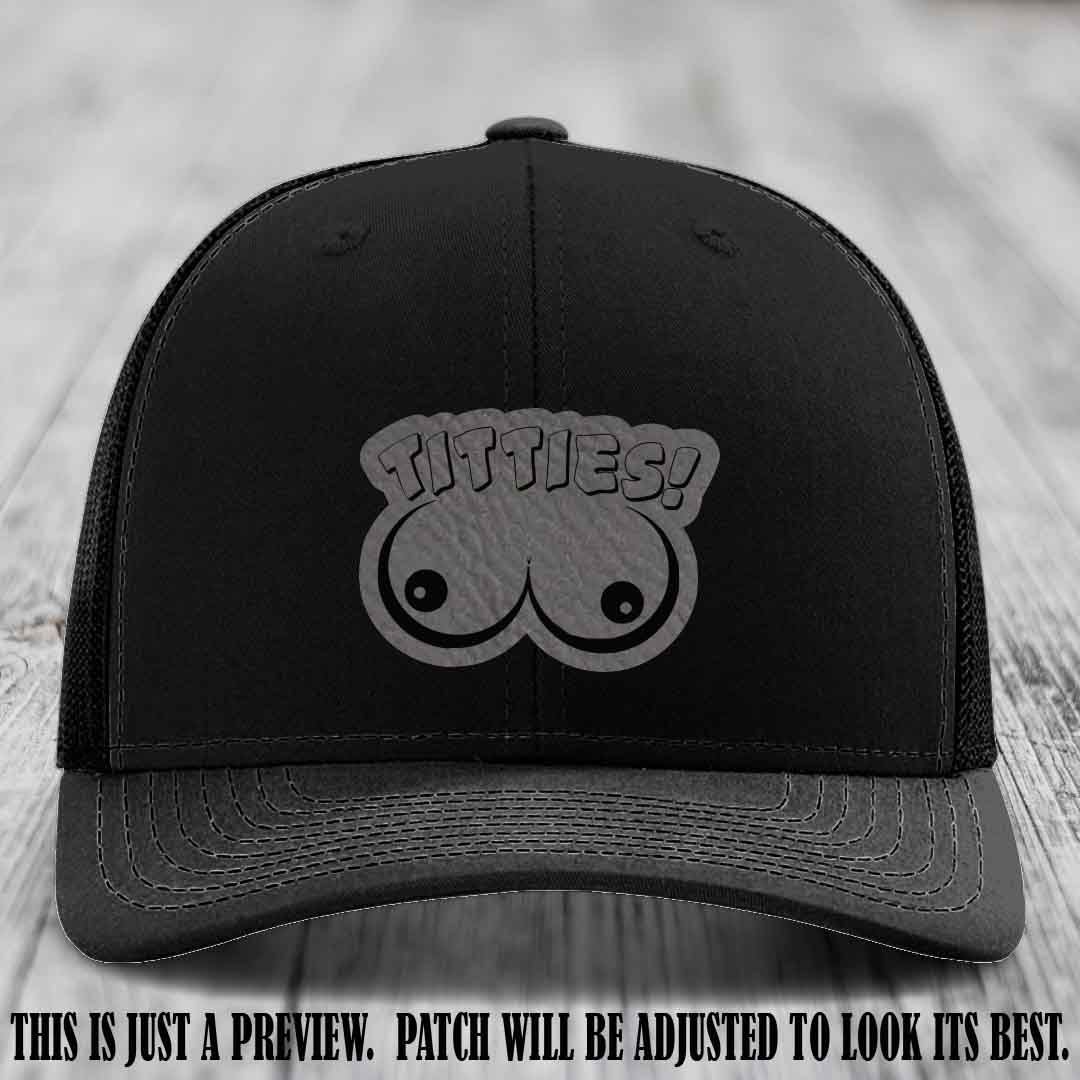 TITTIES! leather patch on Grey to Black Patch mounted on a Black Hat – Richardson 112 funny trucker hat