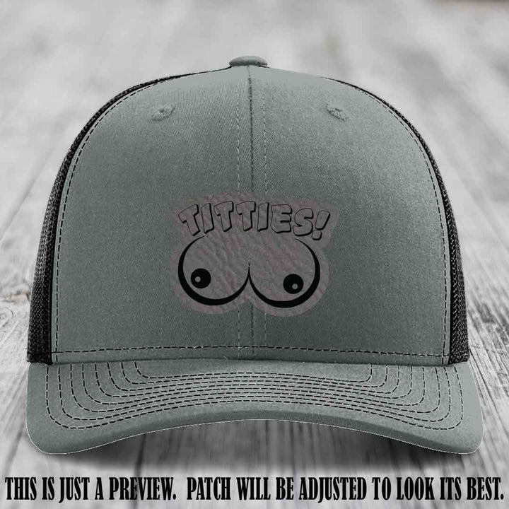 TITTIES! leather patch on Grey to Black Patch mounted on a Heather Grey to Black Hat – Richardson 112 funny trucker hat