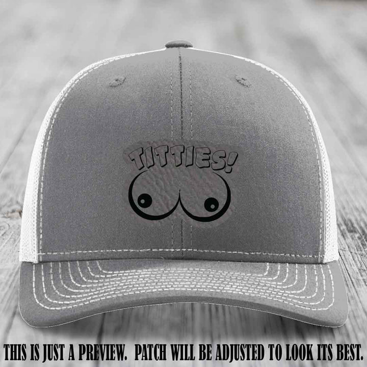 TITTIES! leather patch on Grey to Black Patch mounted on a Heather Grey to White Hat – Richardson 112 funny trucker hat