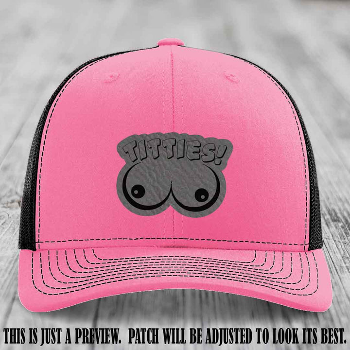 TITTIES! leather patch on Grey to Black Patch mounted on a Hot Pink to Black Hat – Richardson 112 funny trucker hat