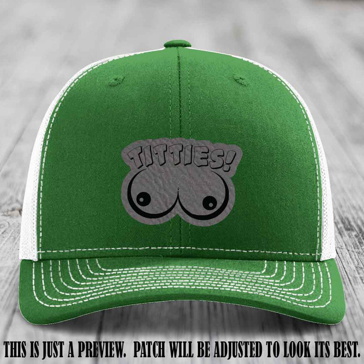 TITTIES! leather patch on Grey to Black Patch mounted on a Kelly to White Hat – Richardson 112 funny trucker hat