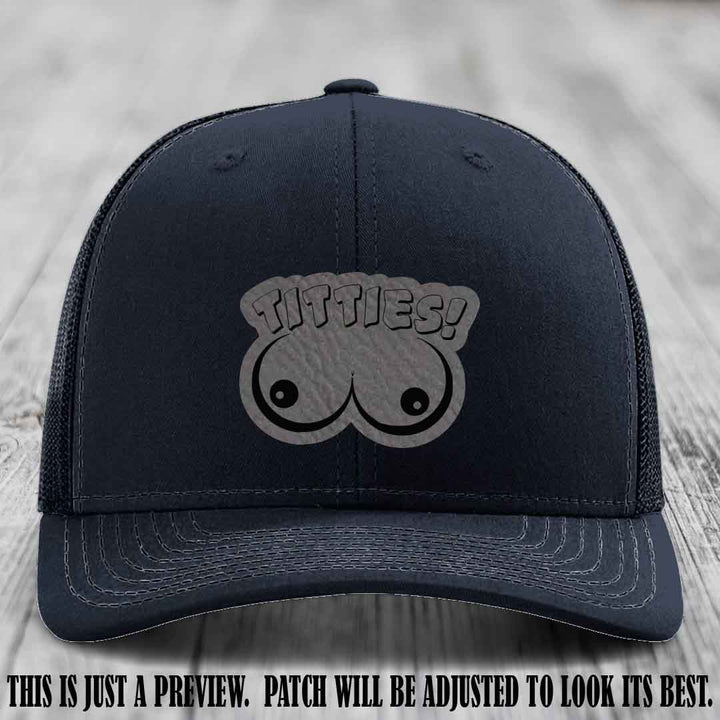 TITTIES! leather patch on Grey to Black Patch mounted on a Navy Hat – Richardson 112 funny trucker hat