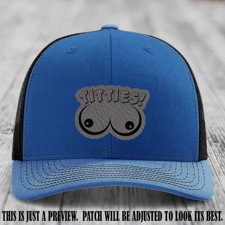 TITTIES! leather patch on Grey to Black Patch mounted on a Royal to Black Hat – Richardson 112 funny trucker hat