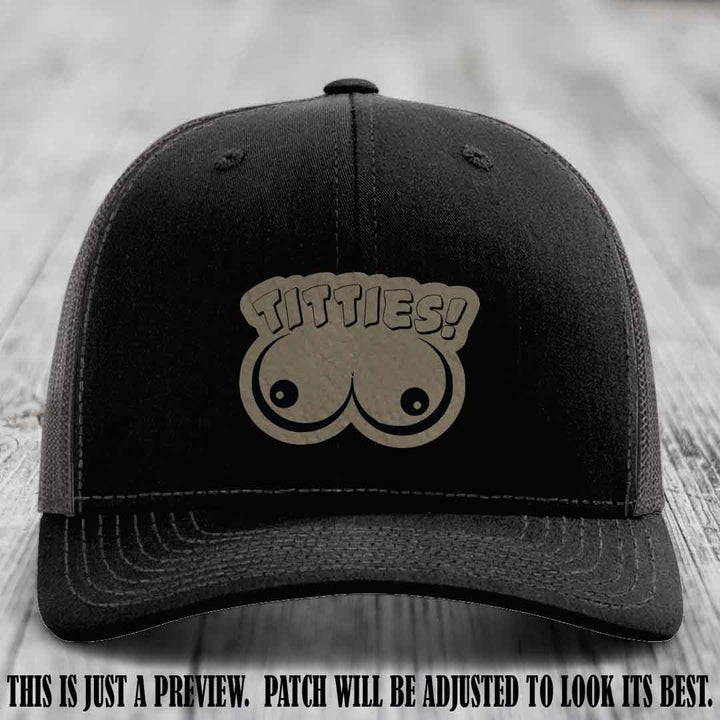 TITTIES! leather patch on Light Brown to Black Patch mounted on a Black to Charcoal Hat – Richardson 112 funny trucker hat
