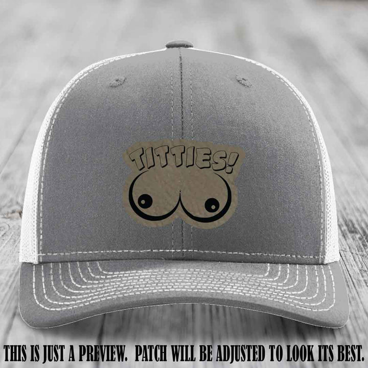 TITTIES! leather patch on Light Brown to Black Patch mounted on a Heather Grey to White Hat – Richardson 112 funny trucker hat