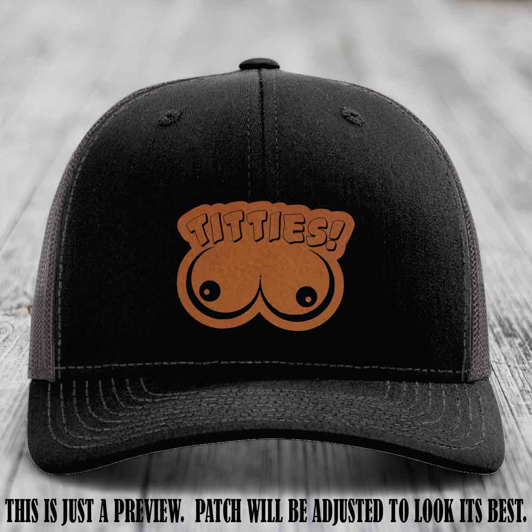 TITTIES! leather patch on Rawhide to Black Patch mounted on a Black to Charcoal Hat – Richardson 112 funny trucker hat