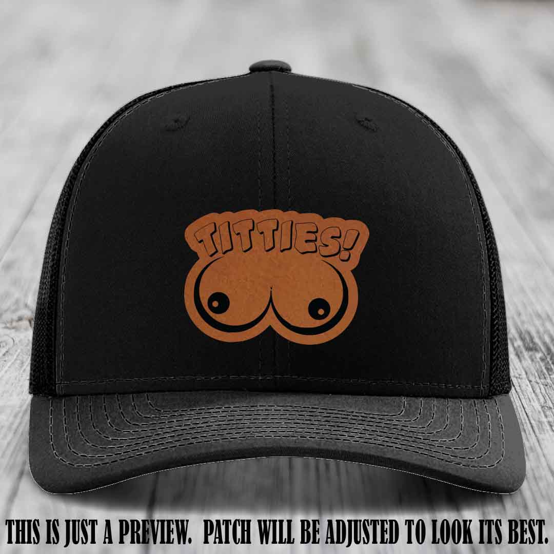 TITTIES! leather patch on Rawhide to Black Patch mounted on a Black Hat – Richardson 112 funny trucker hat