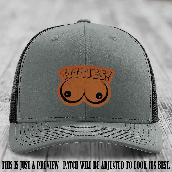 TITTIES! leather patch on Rawhide to Black Patch mounted on a Heather Grey to Black Hat – Richardson 112 funny trucker hat