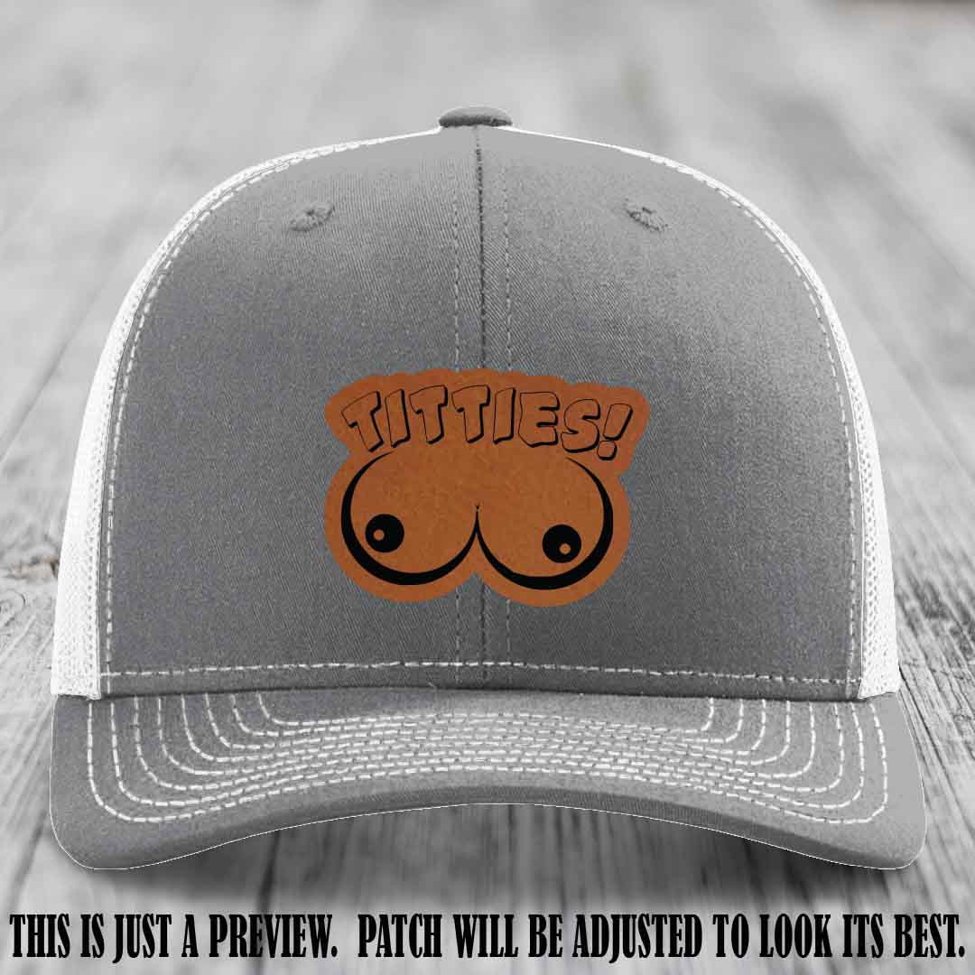 TITTIES! leather patch on Rawhide to Black Patch mounted on a Heather Grey to White Hat – Richardson 112 funny trucker hat