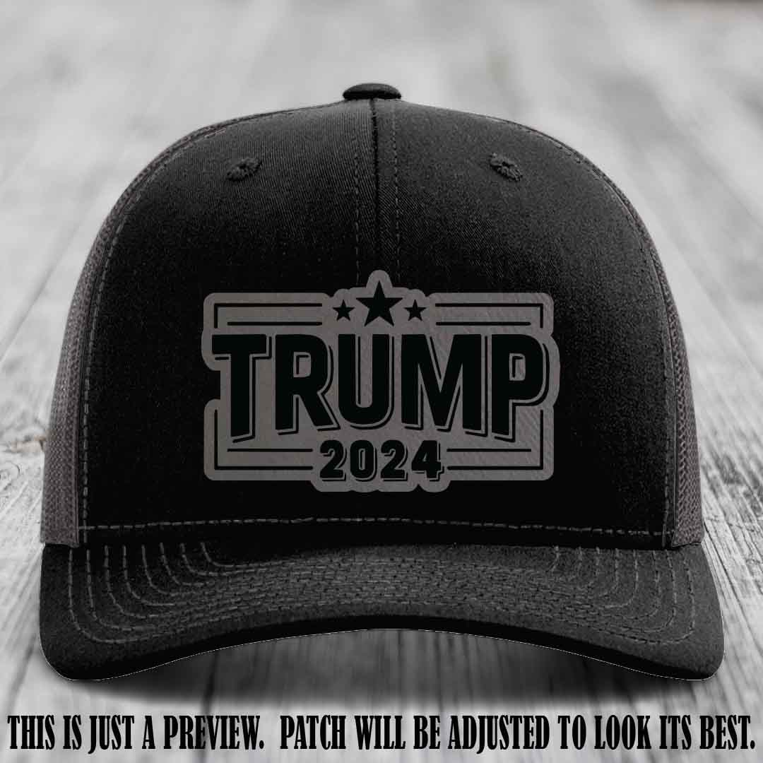 TRUMP 2024 leather patch on Richardson 112 Black to Charcoal Hat with Grey to Black Patch