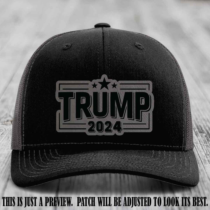 TRUMP 2024 leather patch on Richardson 112 Black to Charcoal Hat with Grey to Black Patch