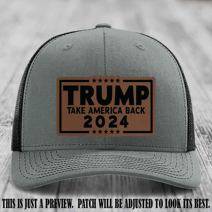 Trump Take America Back 2024 on a Heather Grey to Black Hat with Dark Brown to Black Patch