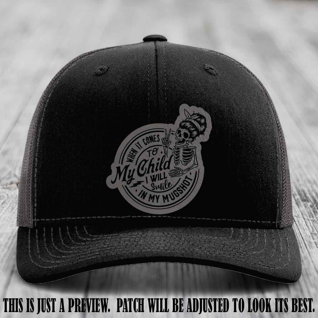 Richardson 112 custom trucker hat with grey to black patch and 'My Child Mugshot' leather patch on black to charcoal hat