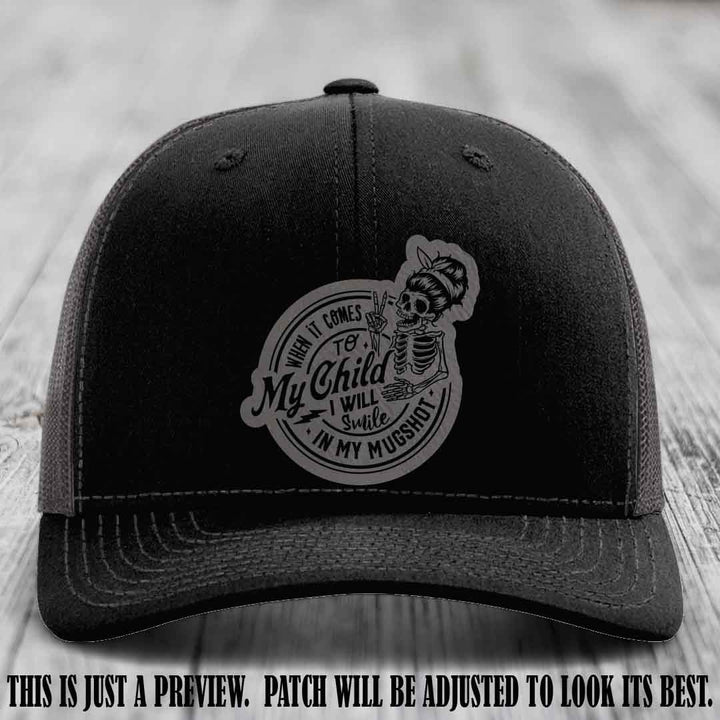 Richardson 112 custom trucker hat with grey to black patch and 'My Child Mugshot' leather patch on black to charcoal hat