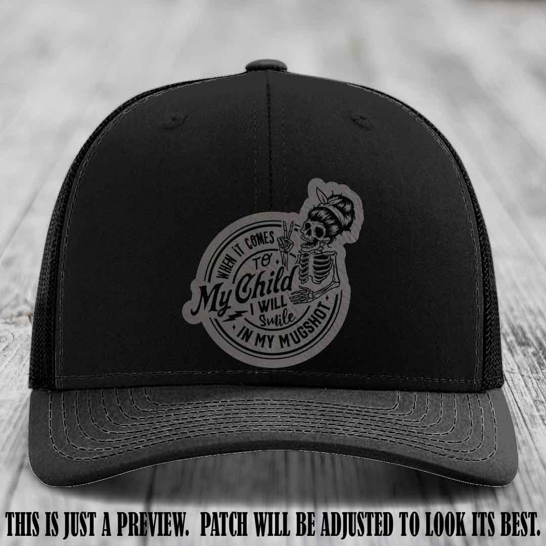 Richardson 112 custom trucker hat with grey to black patch and 'My Child Mugshot' leather patch on black hat