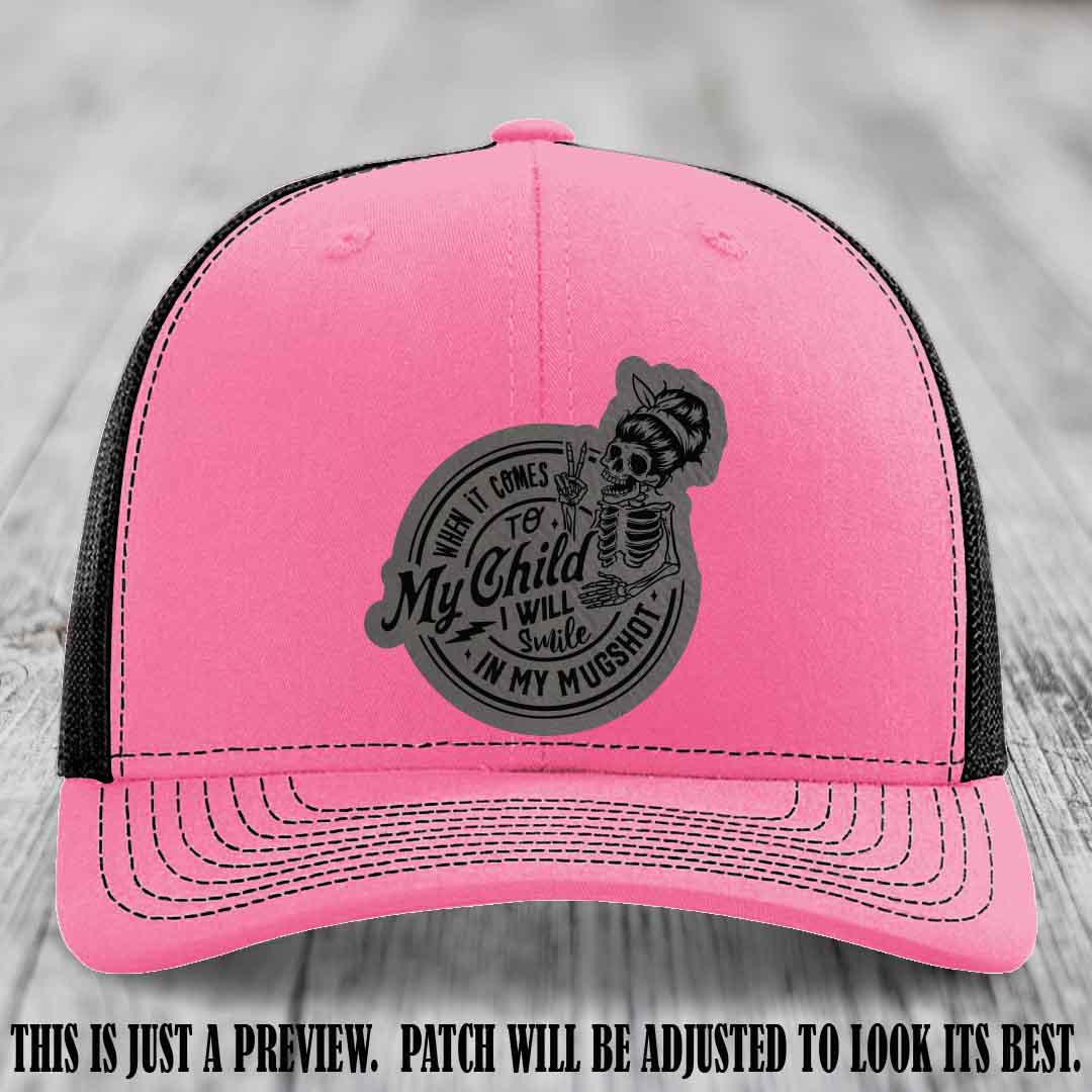 Richardson 112 custom trucker hat with grey to black patch and 'My Child Mugshot' leather patch on hot pink to black hat