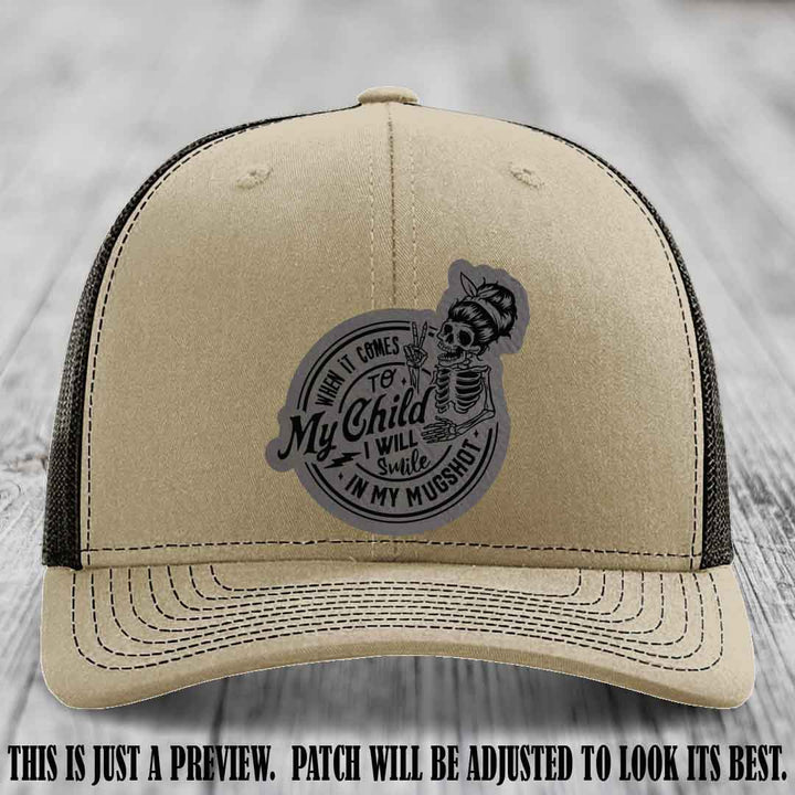 Richardson 112 custom trucker hat with grey to black patch and 'My Child Mugshot' leather patch on khaki to coffee hat