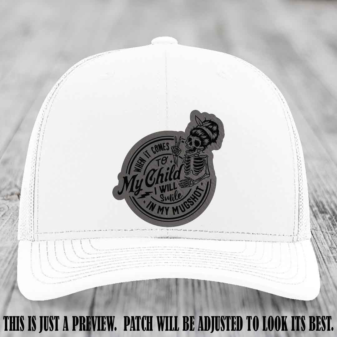 Richardson 112 custom trucker hat with grey to black patch and 'My Child Mugshot' leather patch on white hat