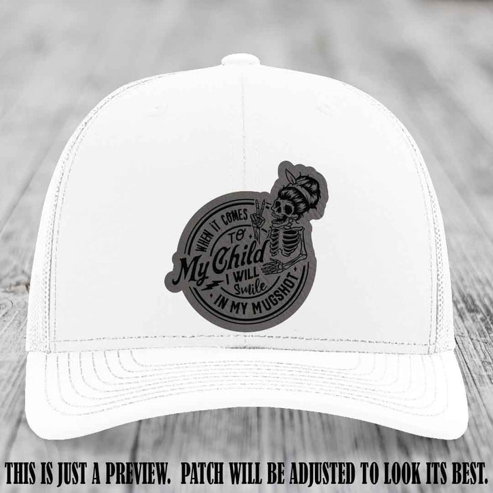 Richardson 112 custom trucker hat with grey to black patch and 'My Child Mugshot' leather patch on white hat