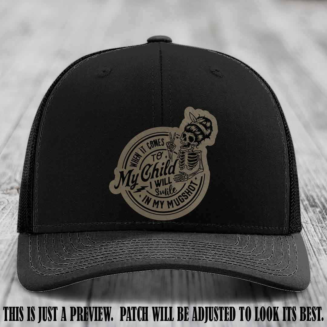 Richardson 112 custom trucker hat with light brown to black patch and 'My Child Mugshot' leather patch on black hat