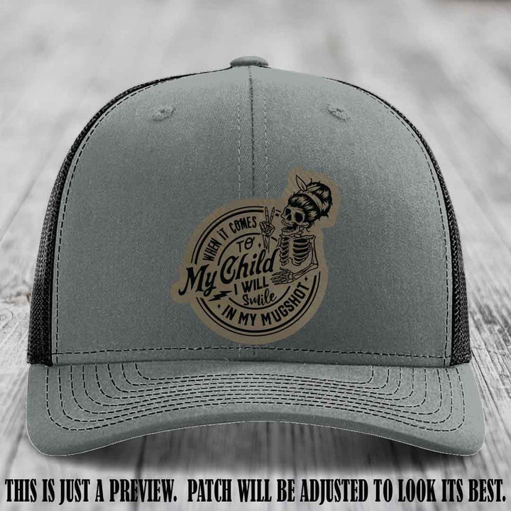 Richardson 112 custom trucker hat with light brown to black patch and 'My Child Mugshot' leather patch on heather grey to black hat