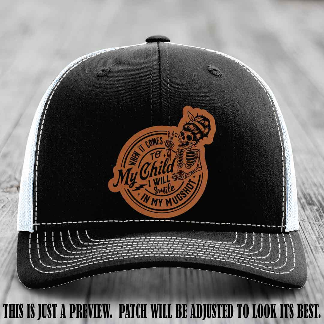 Richardson 112 custom trucker hat with rawhide to black patch and 'My Child Mugshot' leather patch on black to white hat