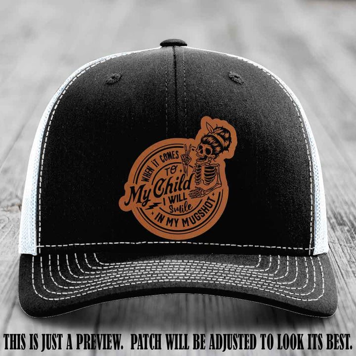 Richardson 112 custom trucker hat with rawhide to black patch and 'My Child Mugshot' leather patch on black to white hat