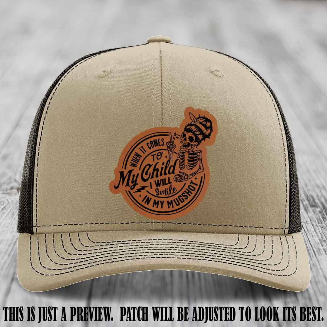 Richardson 112 custom trucker hat with rawhide to black patch and 'My Child Mugshot' leather patch on khaki to coffee hat