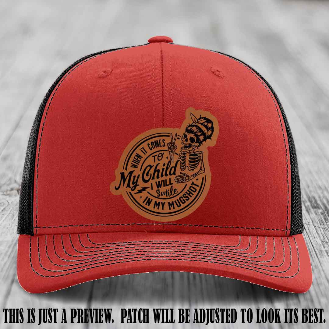Richardson 112 custom trucker hat with rawhide to black patch and 'My Child Mugshot' leather patch on red to black hat