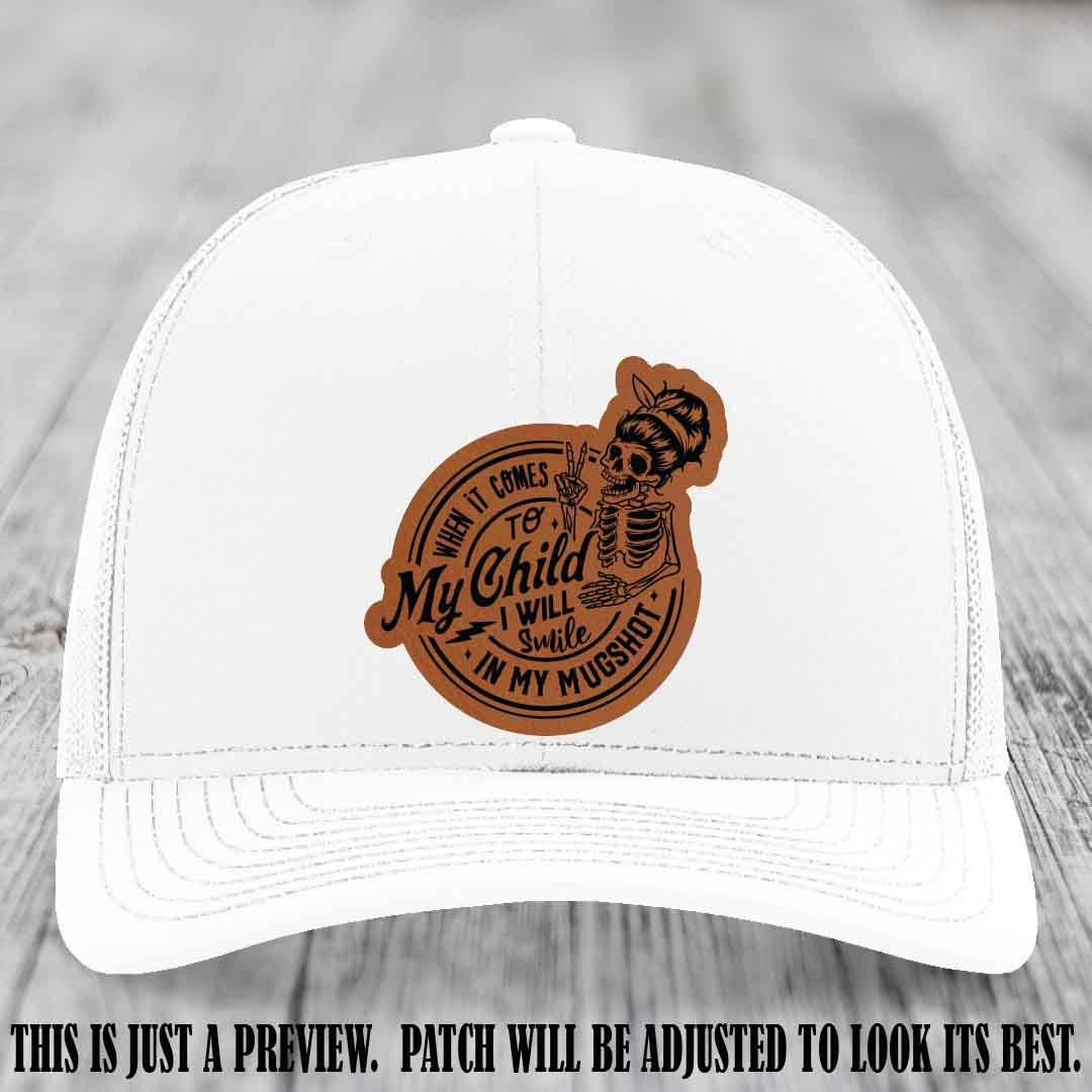 Richardson 112 custom trucker hat with rawhide to black patch and 'My Child Mugshot' leather patch on white hat