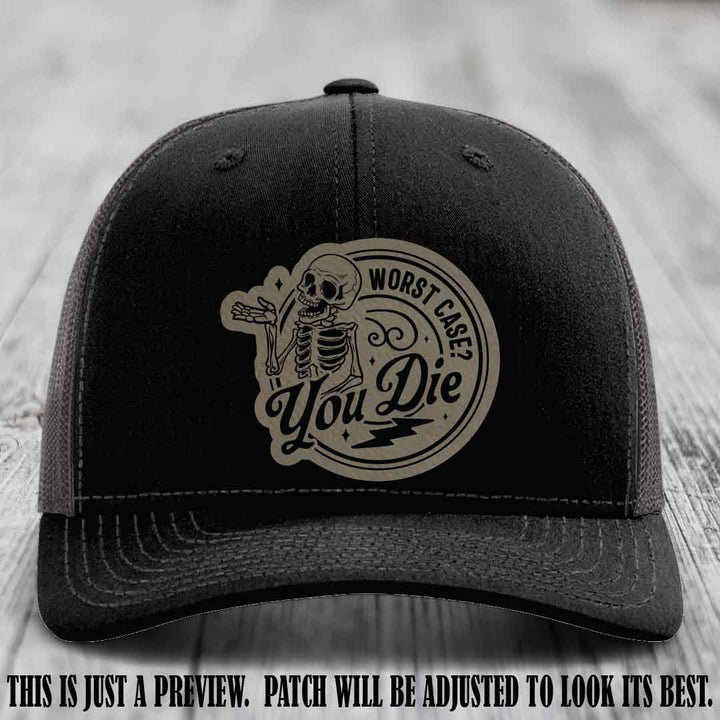 Richardson 112 Black to Charcoal Hat with Light Brown to Black Patch featuring skeleton and phrase 'Worst Case? You Die'